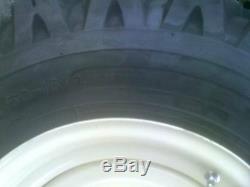 4 skid steer tire snow plowing tires and wheels, fits Bobcat, New Holland, Case