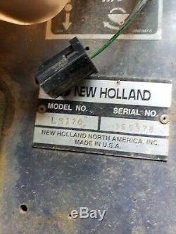 New Holland LS170 skid steer 1,700 hrs heated cab. Runs well