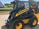 Powered quick attach conversion for Case New Holland / Deere skid loaders